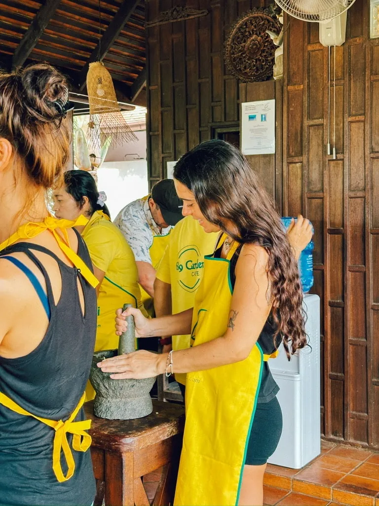Girl using Pestle and Mortar
